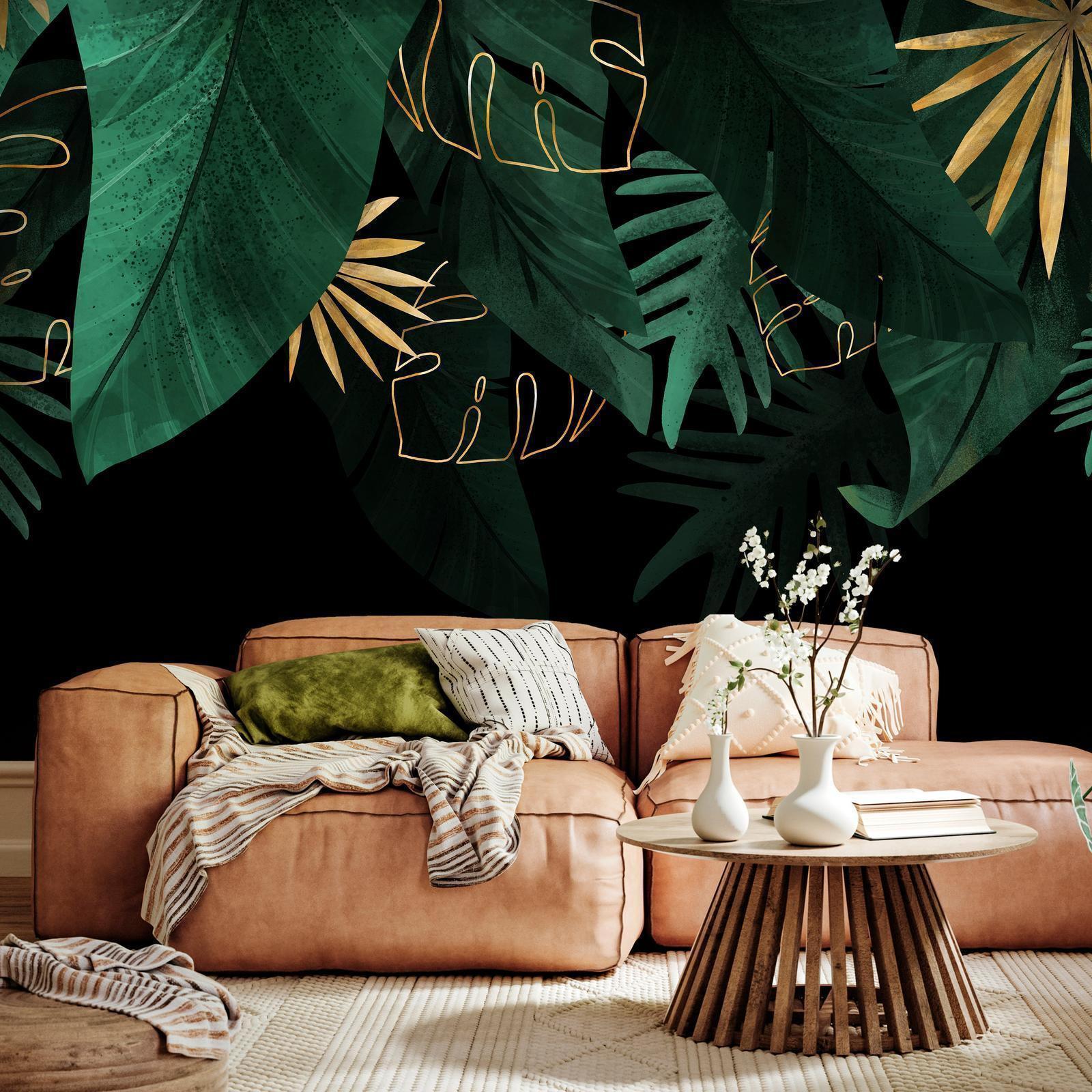 Papier peint - Jungle and composition - motif of green and golden leaves on a black background