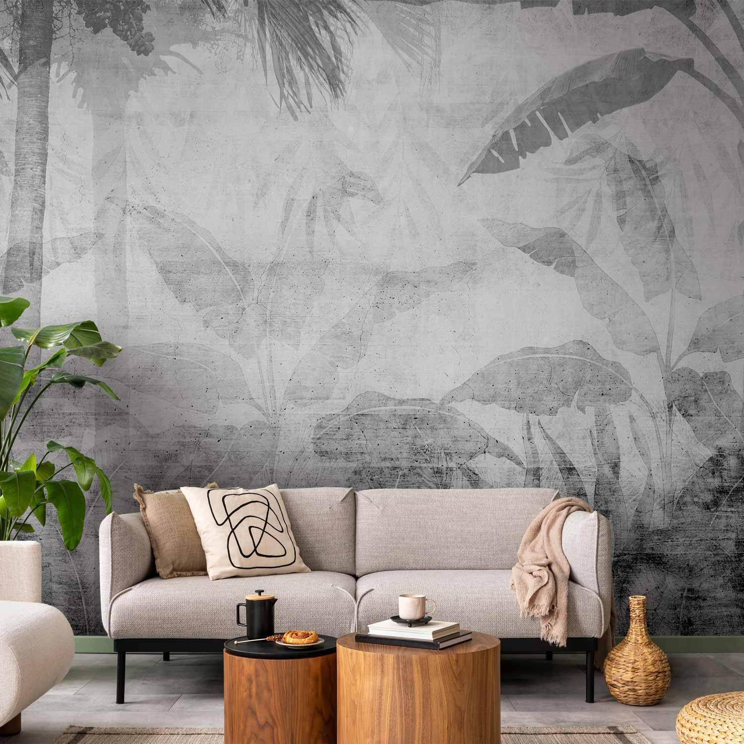 Papier peint - Vanishing jungle - landscape of exotic trees and leaves in grey tones